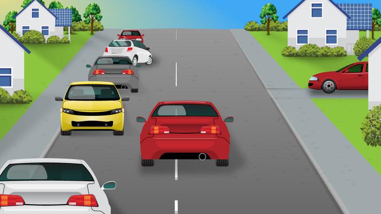 What should a driver be aware of when approaching a vehicle which is attempting to park?