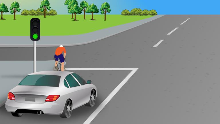 What should the driver of the silver car do before turning left?