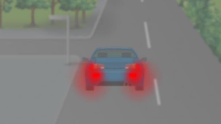 What lights should a driver use in dense fog?